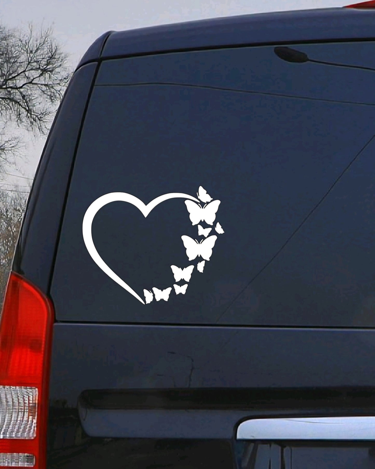Outline Heart with Butterflies Flying Vinyl Decal for water bottles, car windows, and computers. Customizable, high-quality outdoor-rated vinyl made in the USA.